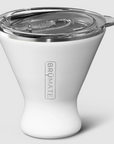 A white, martini glass shaped white insulated cup with clear plastic lid and BRUMATE silver text on side. Photographed on white background. 