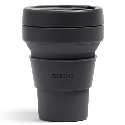 A black plastic travel mug with silicone sleeve that reads, "stojo" photographed on white background. 