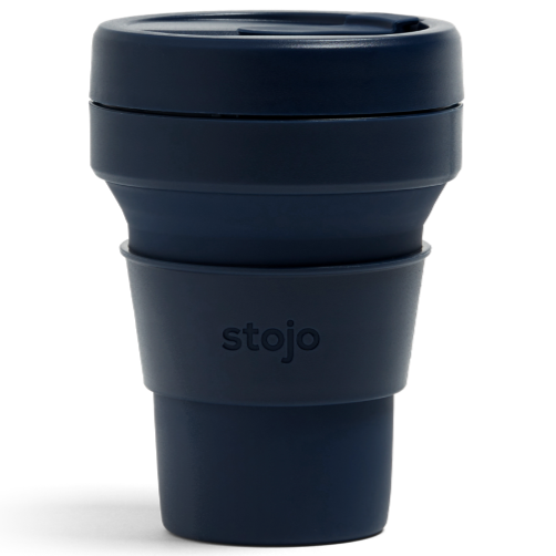 A navy plastic travel mug with silicone sleeve that reads, "stojo" photographed on white background.