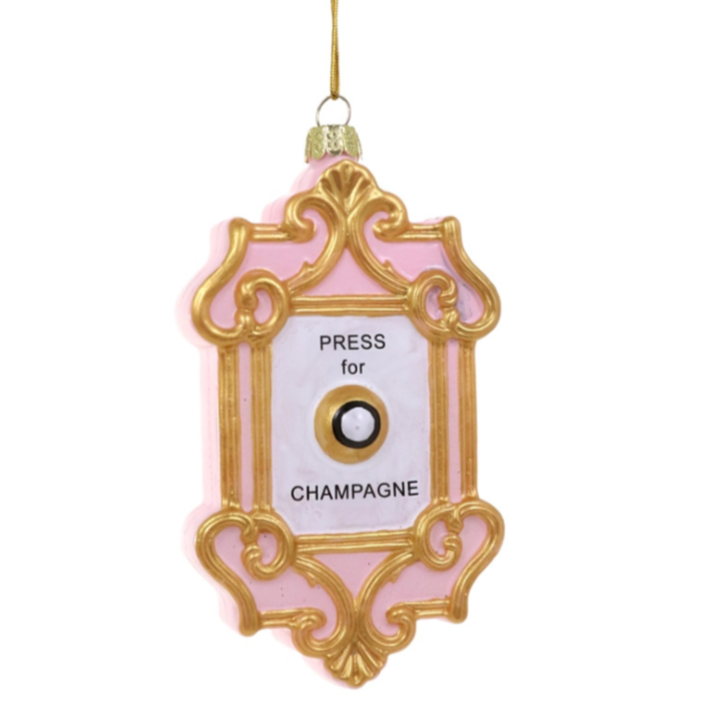 Ornate pink and gold ornament with "Press for Champagne" Button