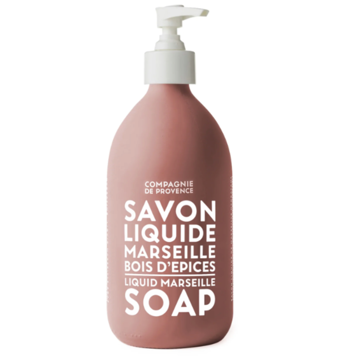 Red glass bottle container for the liquid soap. Hand pump is white and the text with the brand and name of the soap printed in white