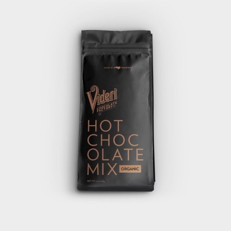 A black plastic resealable back with gold text that reads, "Videri Chocolate Factory Hot Chocolate Mix Organic" photographed on white background.