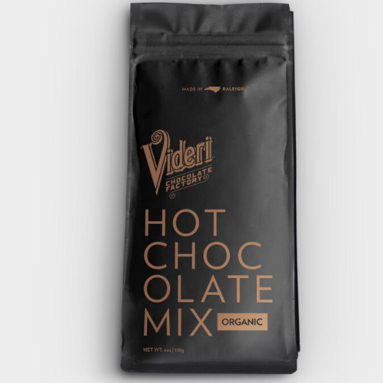 A black plastic resealable back with gold text that reads, "Videri Chocolate Factory Hot Chocolate Mix Organic" photographed on white background.