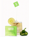 Image shows the SAYSO Skinny Spicy Margarita sachet, a cocktail with the sachet soaking, and sliced jalepeno. 