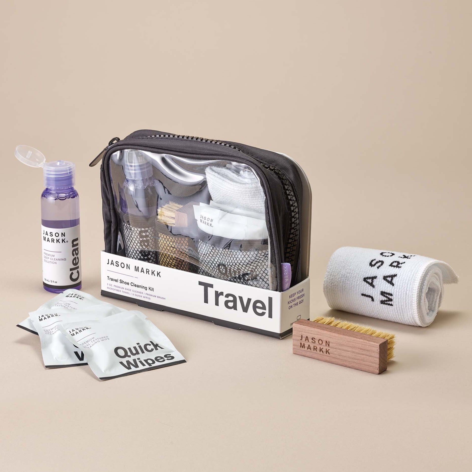 travel care kit in packaging that includes black zipper pouch. items in kit are quick wipes, brush, microfiber towel, and cleaning solution 