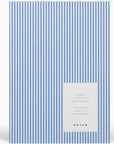 Blue and white vertically stripped notebook