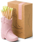 pink ceramic cowboy boot match holder with lime green safety matches by Paddywax.