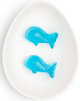 blue whale gummies in white oval dish