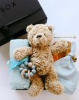 BOXFOX Matte Black Gift Box with "Brown Bear, Brown Bear" Board Book, Alva Blue Knotted Baby Beanie, Alva Blue Wood Teething Ring, Alva Blue Swaddle and Jelly Cat Bumble Bear.