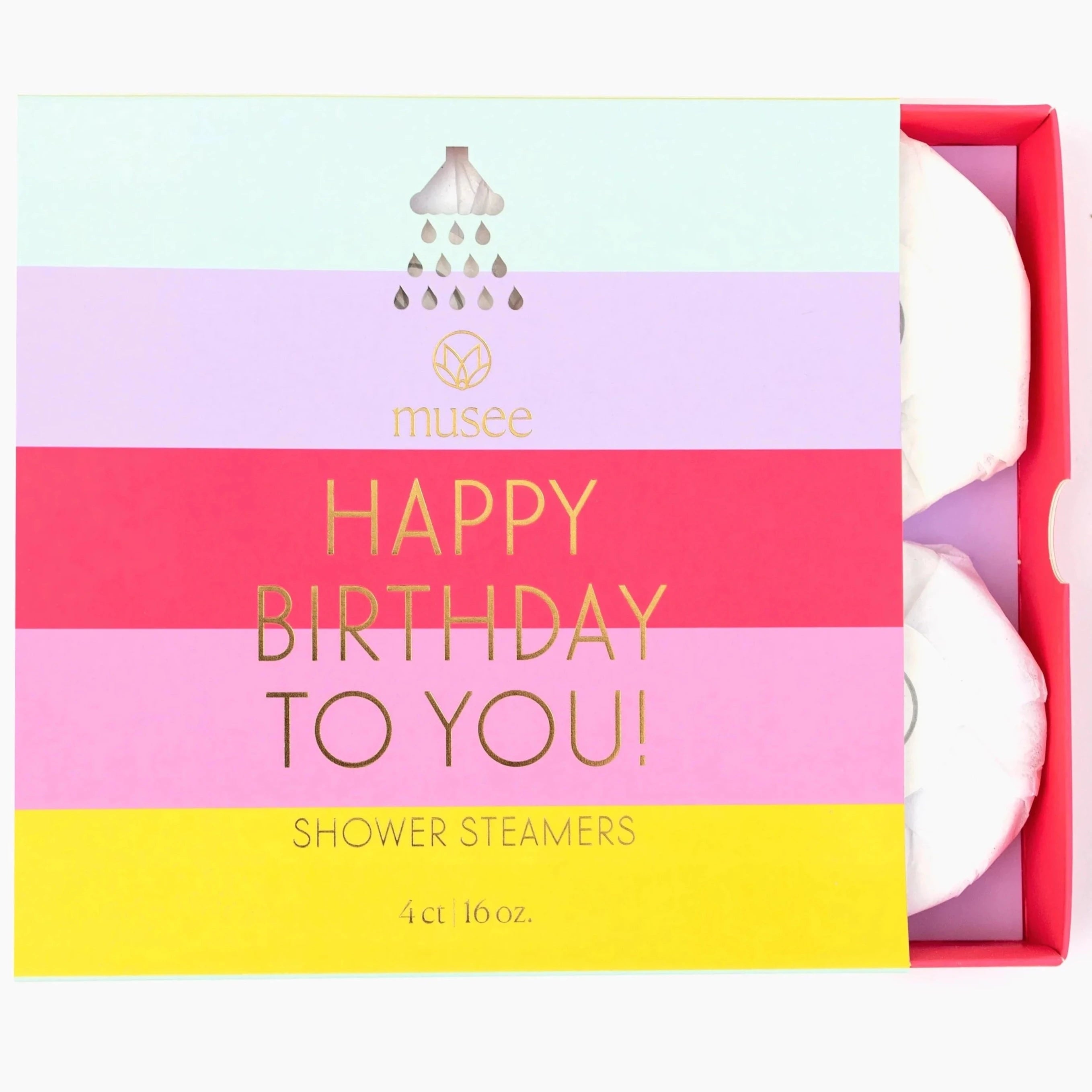 Shower steamer packaging with stripes across the from in Blue, purple, red, pink, and yellow. Gold text that reads "Happy Birthday to You Shower Steamers- 4ct" Box is slightly opened to show shower steamers inside that are wrapped in white paper