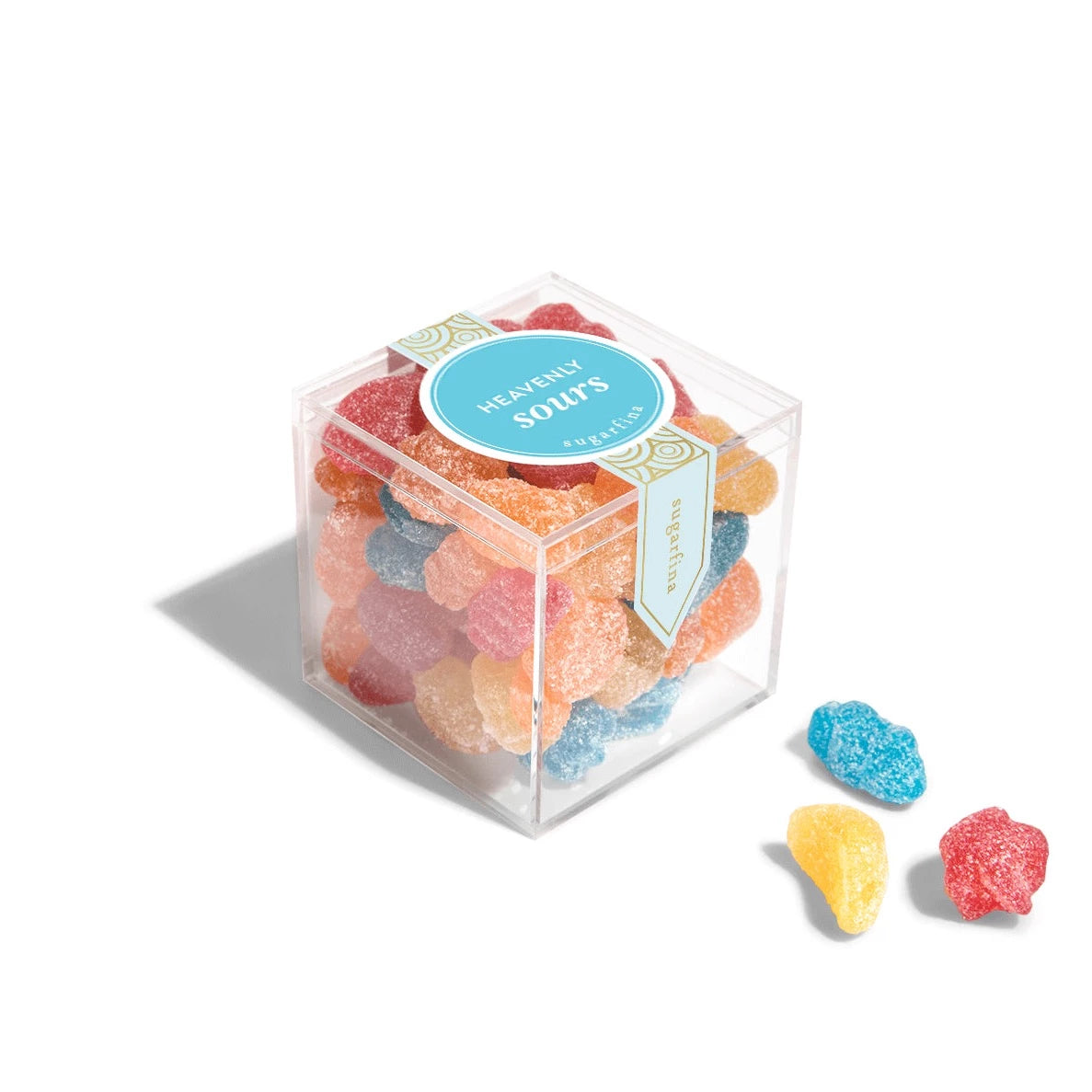 clear acrylic cube containing the colorful star and moon shaped candy