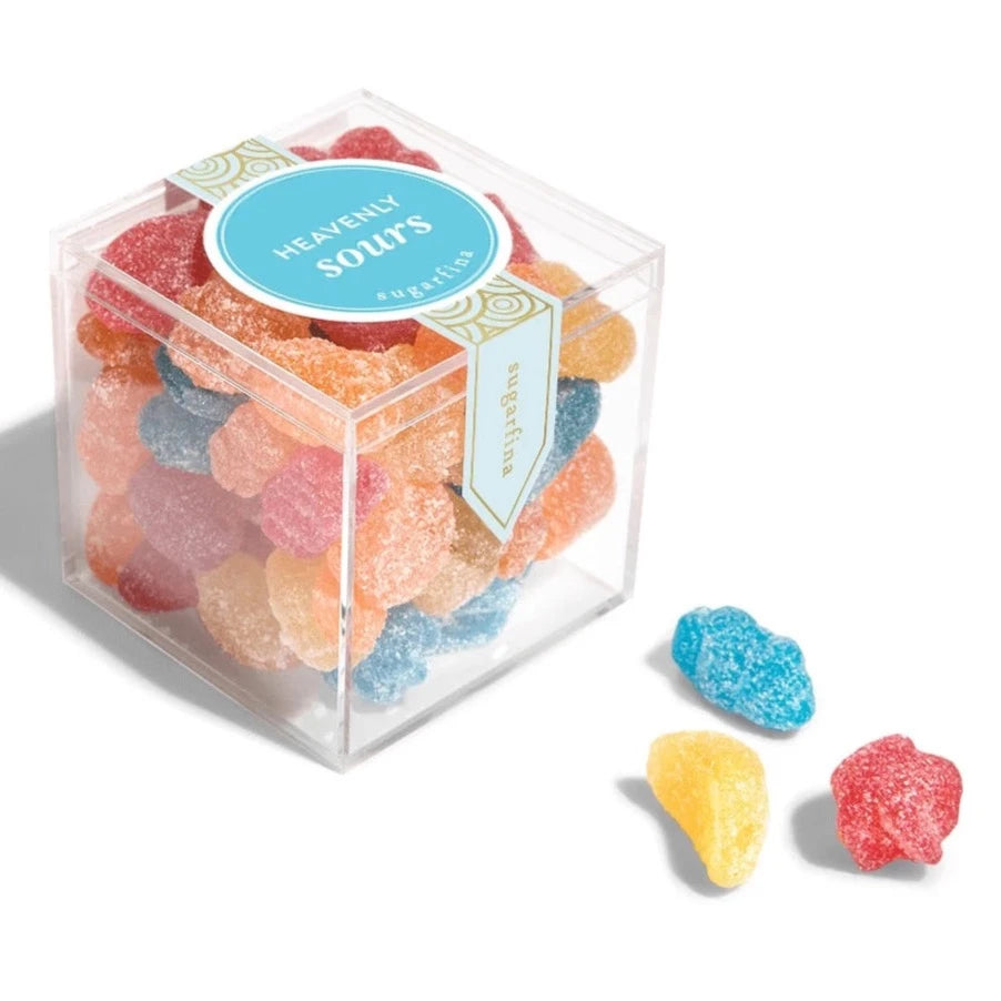 clear acrylic cube containing the colorful star and moon shaped candy