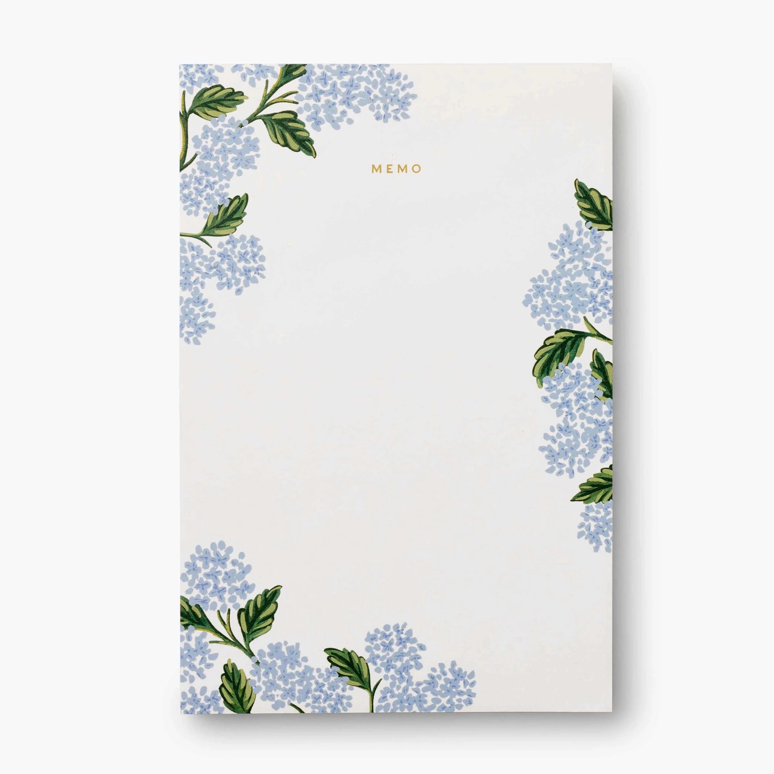 Large white memo pad with "memo" in gold foil at the top. Blue hydrangeas decorating the borders of the notepad. 