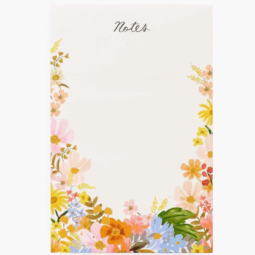 Cream notepad with flower detail at the bottom and wrapping around the sides.